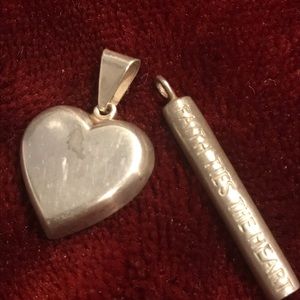 Two silver pendants one heart one scroll